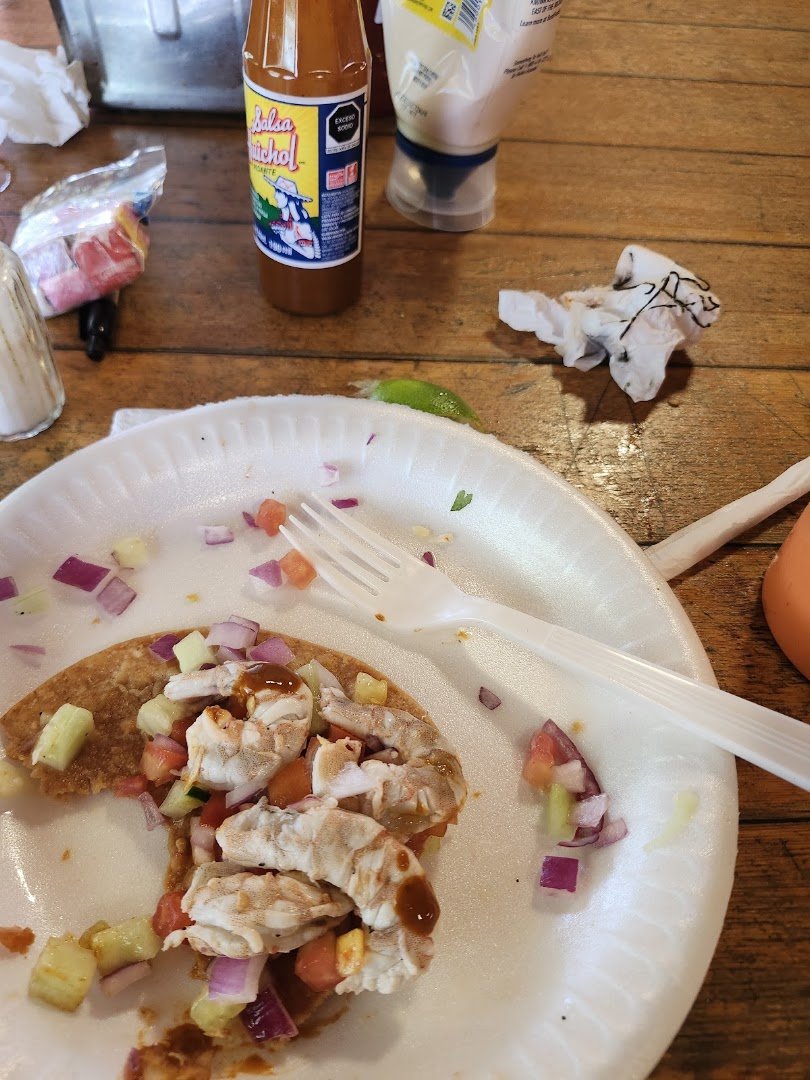 Tables set for Mexican plates and cold drinks.