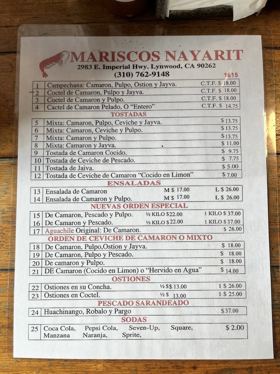 Printed menu featuring oysters and fish plates.