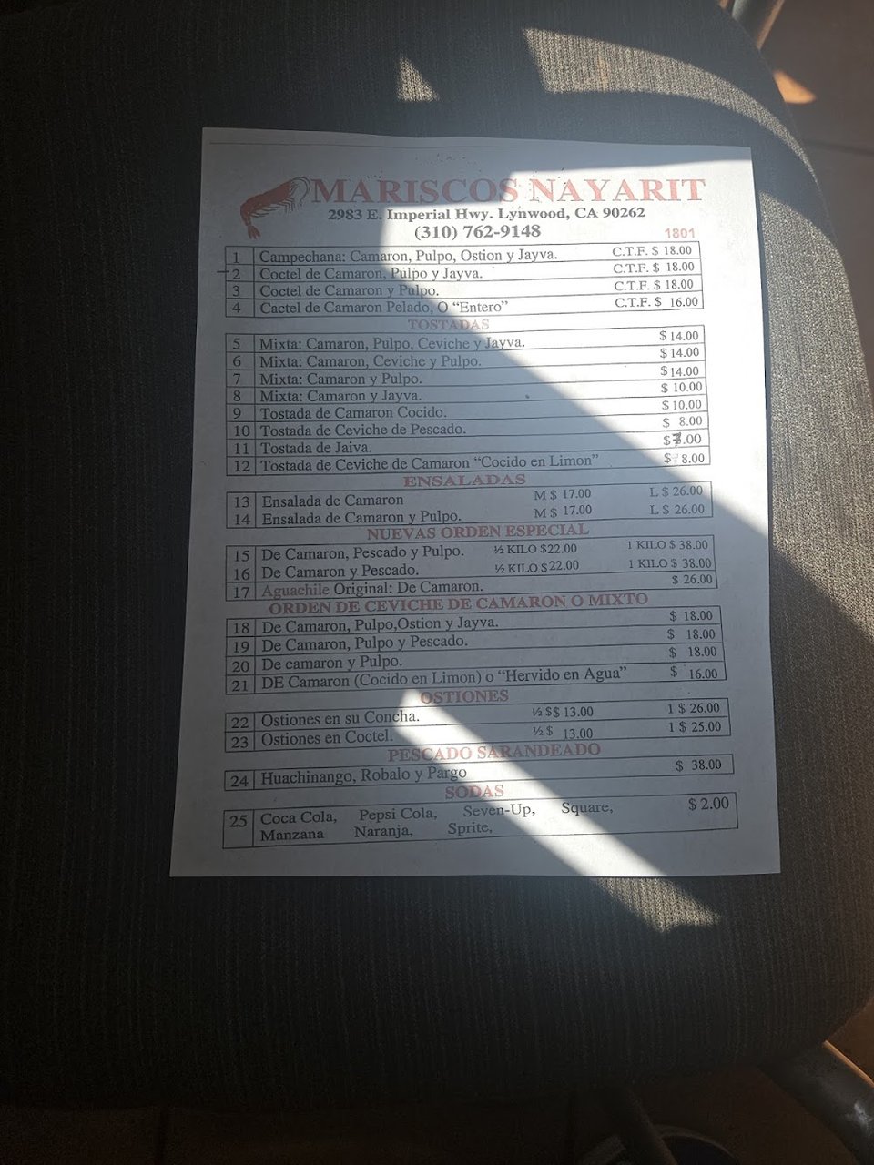 Menu page with tostadas and ceviche sections.